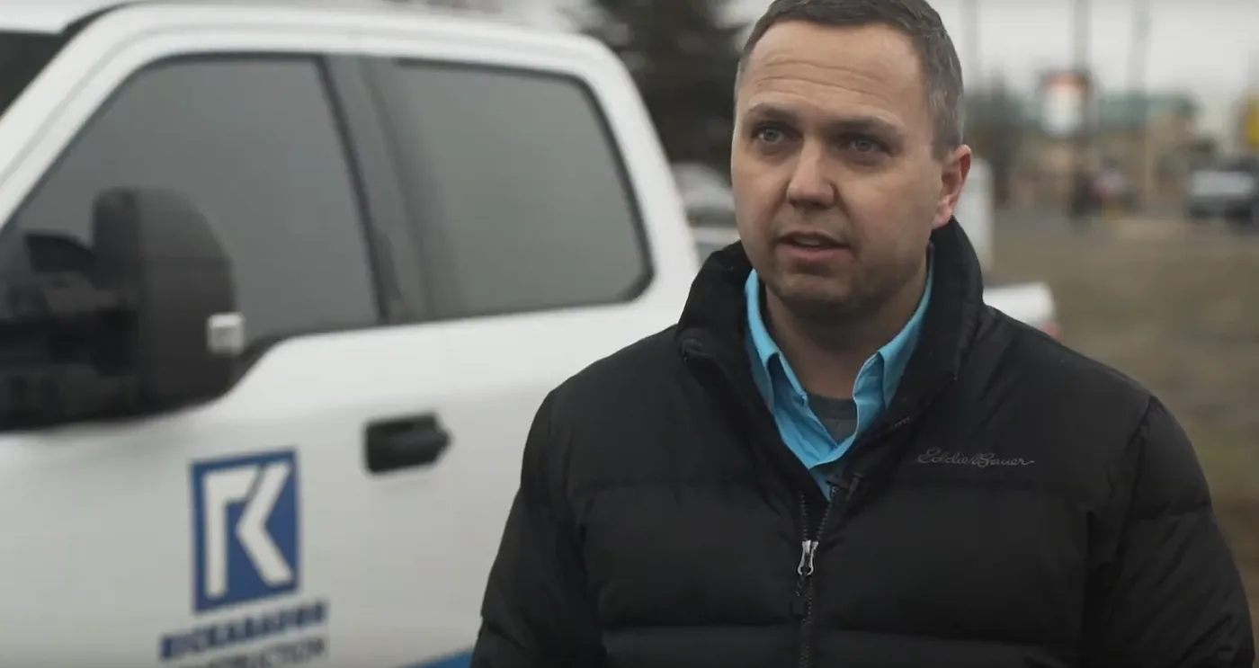 Marc Rickabaugh of Rickabaugh Construction beside a company truck